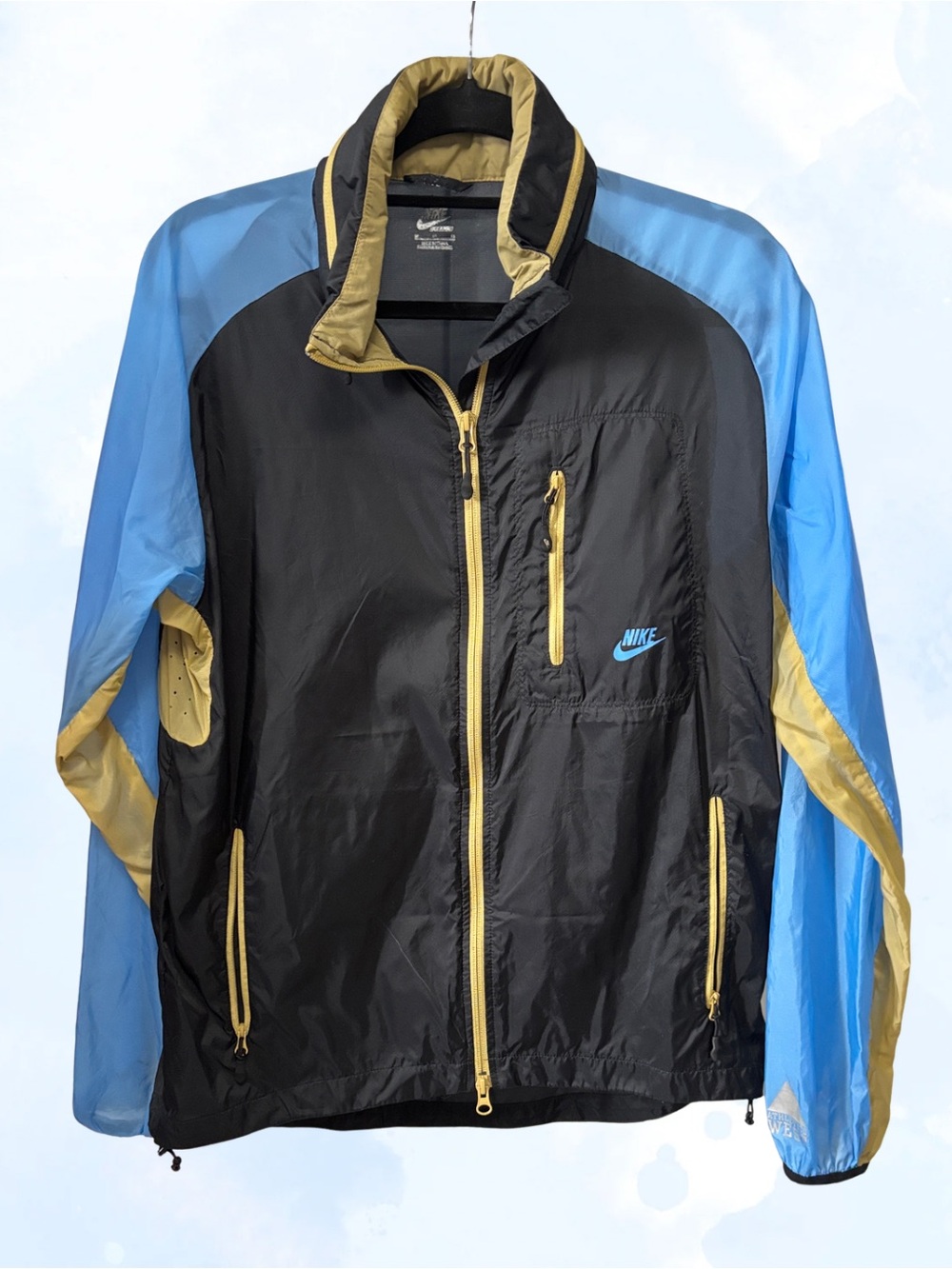 Nike Black Windbreaker Jacket with Light Blue Sleeves and Gold Trim